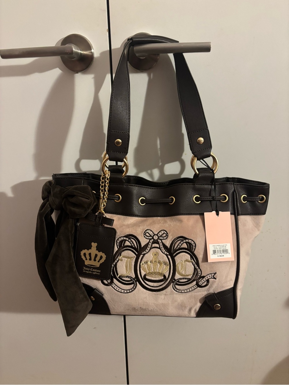 Juicy Couture lovers club tote color is dusty blush slight tan and light pink
